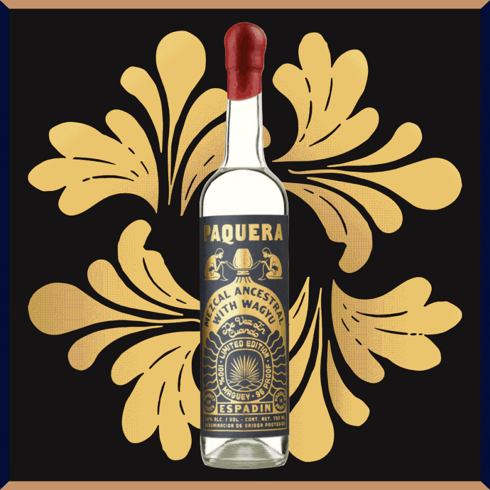 Bottle of Paquera Mezcal 'Mezcal Ancestral with Wagyu' made with Espadin Agave. A limited edition bottle with gold leaf print.